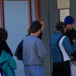 Dad Standing In Line Buying The Lift Tickets.