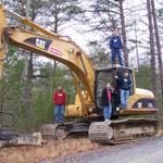 Michael, Austin, Dustin & Josh Standing On The Trackhoe That Was Used To Fix The Road Back To Litte Dugger Creek, It Was Was