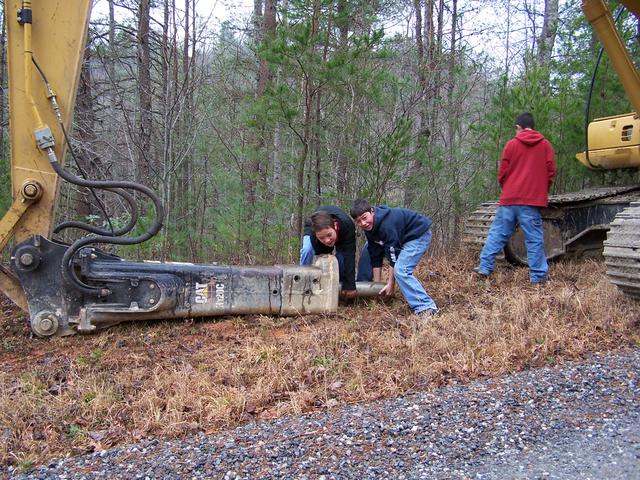 Dustin & Josh Trying To Pick Up The Hammer On The Trackhoe. 