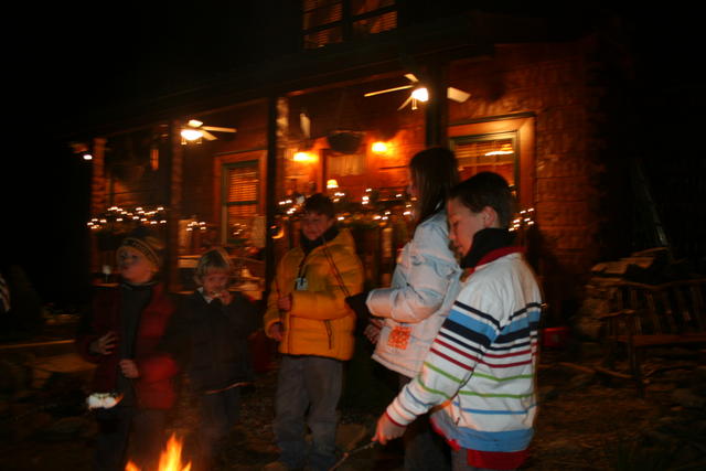 Everyone Gathered Around Making Smores.