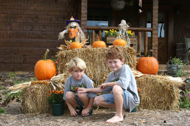 Blake & Grayson In Front Of Fall Decorations.