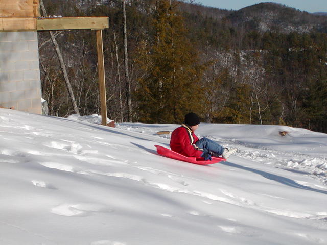 Dustin Sleding Down Side Of House