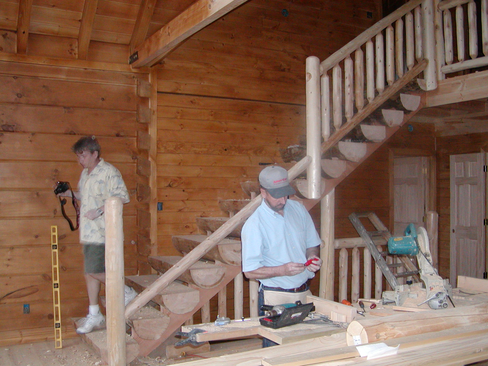 Jack Coming Down The Stairs And Bobby Working On The Railing That Is Coming Down The Stairs.