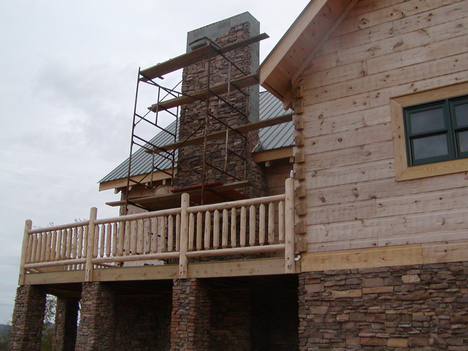 Working On The Stone On The Outside Of The Fireplace.