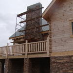 Working On The Stone On The Outside Of The Fireplace.