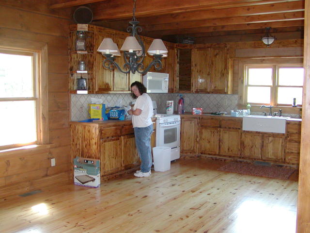 Patty Working In The Kitchen After Sink, Stove And Refrigerator Put In.