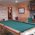 Pool Table In Basement With Fireplace