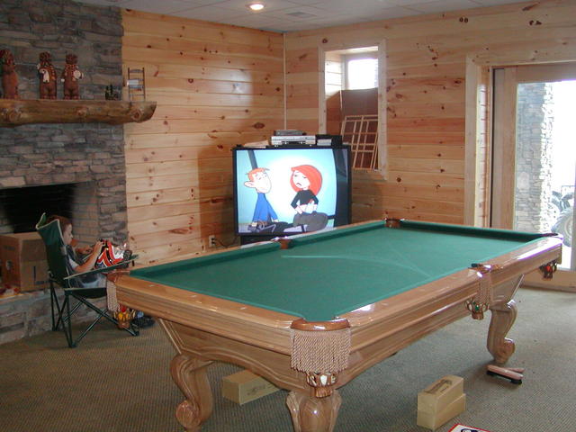 Dustin Watching Big Screen TV In Basement