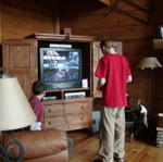 Brandan and Ian Playing Video Game on New TV In Living Room.