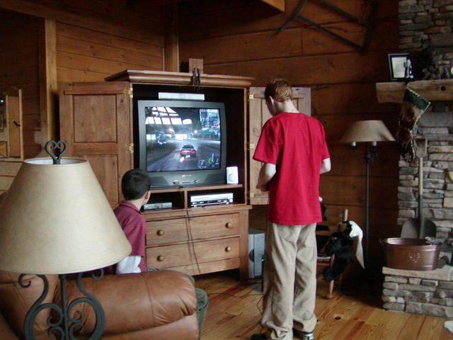 Brandan and Ian Playing Video Game on New TV In Living Room.