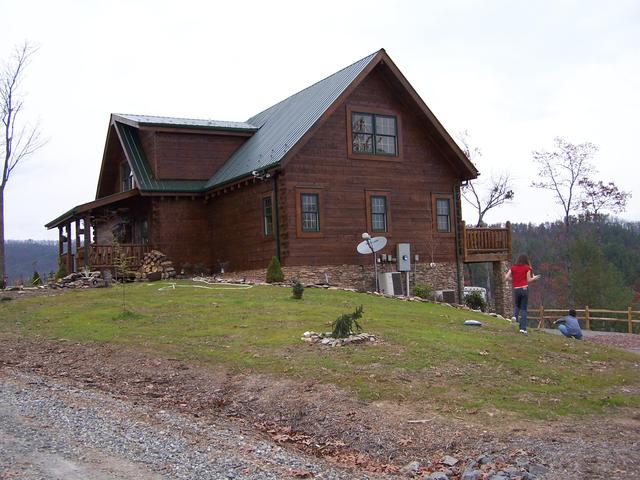 Cabin Now Has Two Coats Of Stain, Which Gives It More Of A Cabin Look. We Have Also Added A Split Rail Fence Around The Driveway